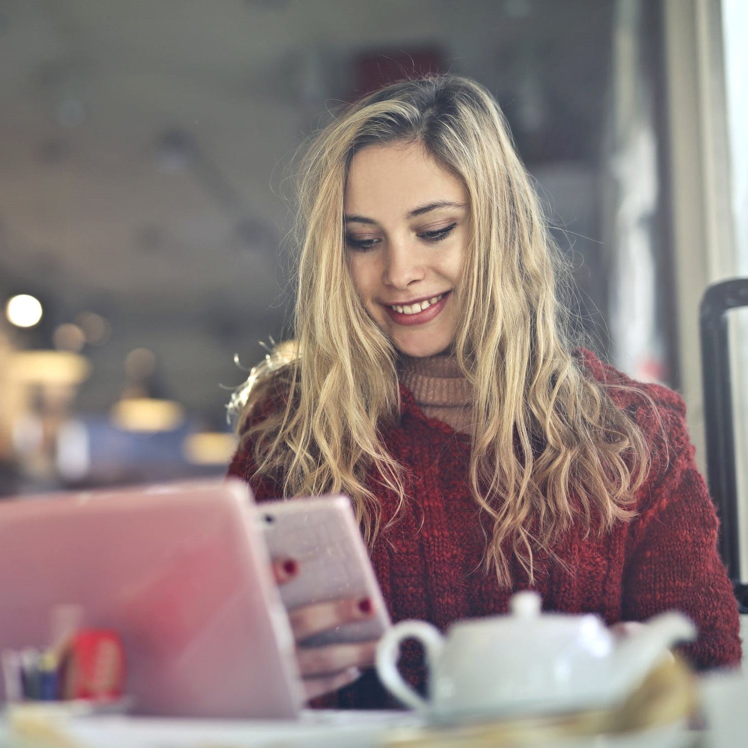 Smiling woman looking at smartphone
